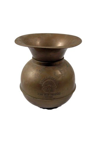 Back to the Future Part III Spittoon Movie Props: This brass spittoon adorned the wild west set during filming of Back to the Future Part III (1990), the third installment of the series whereby Marty travels back to 1885 to rescue Dr. Emmett "Doc" Br