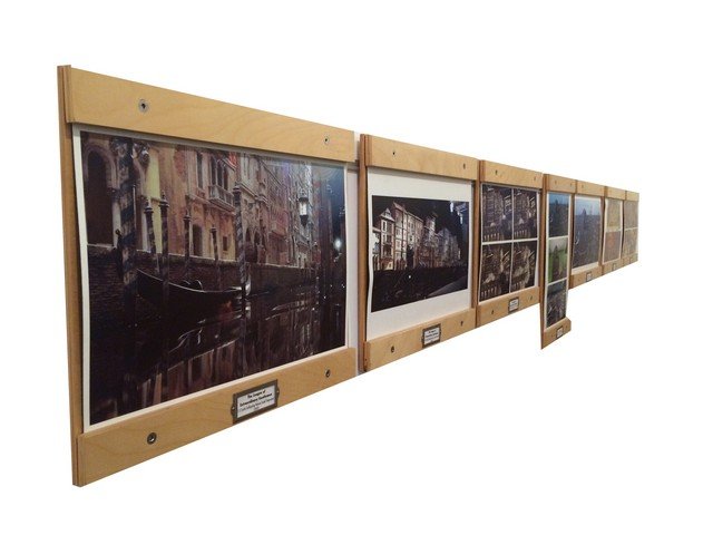 Birch Picture Frame System: These custom fabricated picture hanging system was created and used by New Deal Studios in their studio. Pictures mount by loosening allen screws top and bottom, sliding in a picture and clamping down