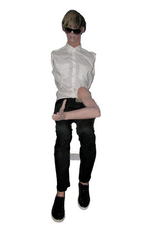 Brüno (Sacha Baron Cohen) Mannequin Movie Props: rom the hilarious comedy Brüno (2009) starring Sasha Baron Cohen is Brüno's (Sacha Baron Cohen) screen used full size sitting down mannequin with white cut-off dress shirt, wig, black pants, and bla