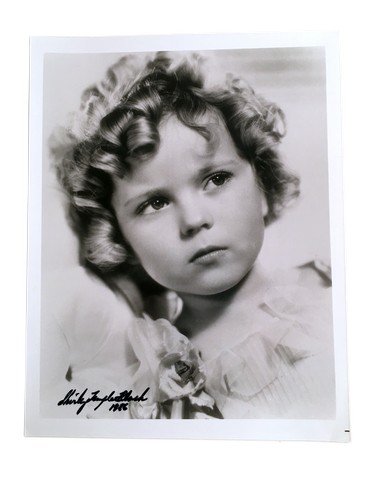 Shirley Temple Autographed Photo: From of the biggest and world adored child actors of all time, Shirley Temple's autographed photo from 1986. Measures approximately 8" x 10".