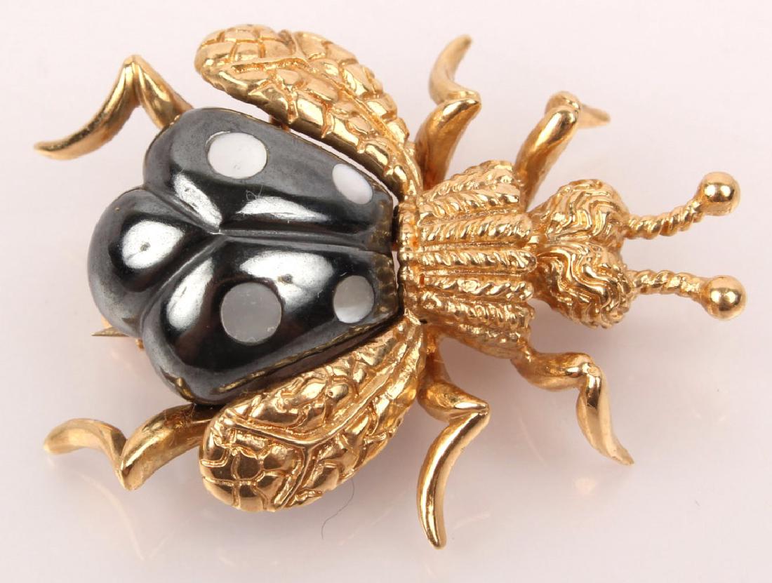 14K YELLOW GOLD BEETLE PIN STAMPED WINC: 14K YELLOW GOLD BEETLE PIN STAMPED WINC Designer pin signed "Winc" copyright, and stamped 14K. Made to resemble a beetle. Weight: 15.4 Grams Size: 35 x 25mm