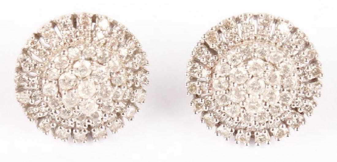 PAIR OF 14K WHITE GOLD CLUSTER DIAMOND EARRINGS: PAIR OF 14K WHITE GOLD CLUSTER DIAMOND EARRINGS Ladies 14K White Gold Diamond Fashion Earrings in Round Cluster Setting. Weight: 4.8 grams Size: 13mm