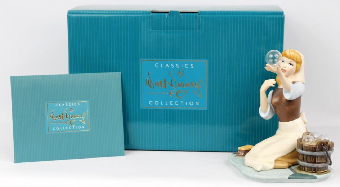 CLASSIC WALT DISNEY COLLECTION - CINDERELLA: CLASSIC WALT DISNEY COLLECTION - CINDERELLA Walt Disney's classic collection of figurines. "They Cant Stop Me From Dreaming." Marked with a Steam boat Wheel, issue 195. Made in 1992. Cinderella with s