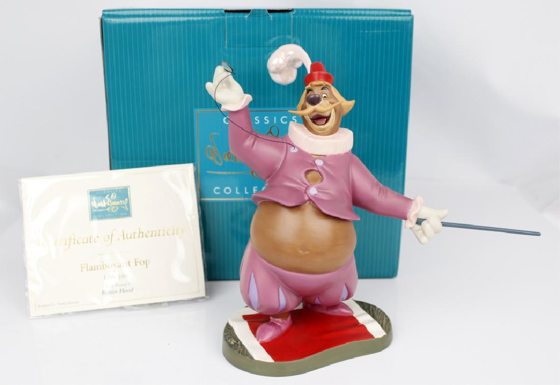 CLASSIC WALT DISNEY COLLECTION - ROBIN HOOD: CLASSIC WALT DISNEY COLLECTION - ROBIN HOOD Walt Disney's Classic Collection Figurines. From Robin Hood titled "Flamboyant Fop." Little John. Marked with the Sombrero 2002. issue 175, Disney number 12