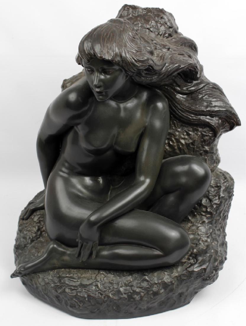 LLADRO RELEIF SCULPTURE NUDE KNEELING WOMAN: LLADRO RELEIF SCULPTURE NUDE KNEELING WOMAN A black Lladro figure, Youthful Innocence. c.1987-89. Modeled as a nude female kneeling on a naturalistic mound. Size: 20"