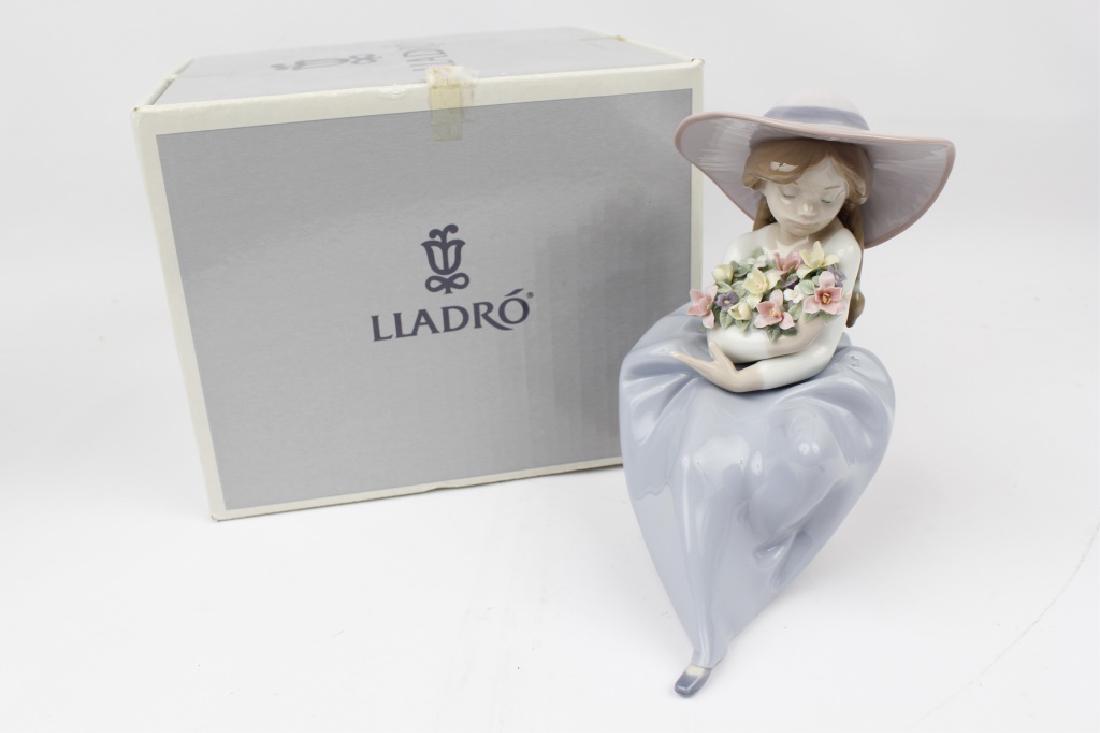 LLADRO PORCELAIN FIGURINE FRAGRANT BOUQUET: LLADRO PORCELAIN FIGURINE FRAGRANT BOUQUET Lladro porcelain figurine "Fragrant Bouquet" number 5862, a little girl in a large hat cradling a large bunch of flowers. Hand crafted in Spain and in origin