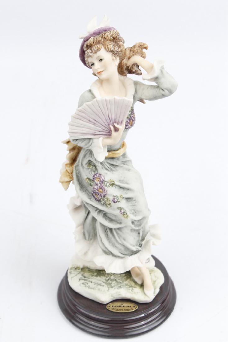 GIUSEPPE ARMANI FIGURINE VIOLET: GIUSEPPE ARMANI FIGURINE VIOLET Giuseppe Armani figurine titled "Violet". Figurine of the year 1998. Made in Italy and in original box. Size: 10"