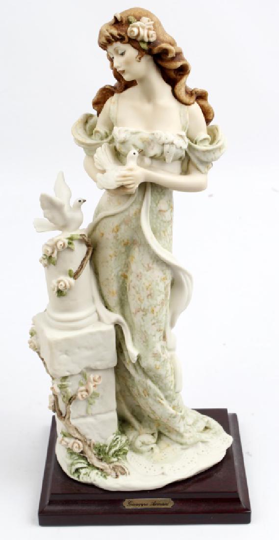 GIUSEPPE ARMANI FIGURINE GIRL WITH DOVE: GIUSEPPE ARMANI FIGURINE GIRL WITH DOVE Giuseppe Armani figurine titled "Girl with Dove". 1987, rare. Made in Italy and no original box. Size: 13"