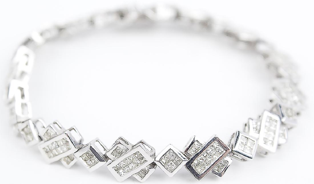 14K WHITE GOLD DIAMOND LADIES TENNIS BRACELET: 14K WHITE GOLD DIAMOND LADIES TENNIS BRACELET 14k white gold diamond ladies tennis bracelet. Interesting art deco style with a safety clasp. Over 1.75ct of diamonds made up of (234) .008ct square cut 