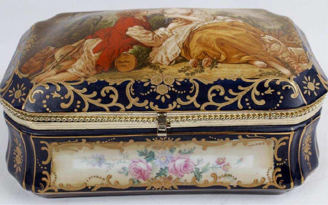 LIMOGES PORCELAIN BRASS ENAMELED DRESSER BOX: LIMOGES PORCELAIN BRASS ENAMELED DRESSER BOX Limoges porcelain dresser box. Enameled with gold filigree hand painted detail and brass finishing. Floral detail on the interior. Stamped in bottom. Size: