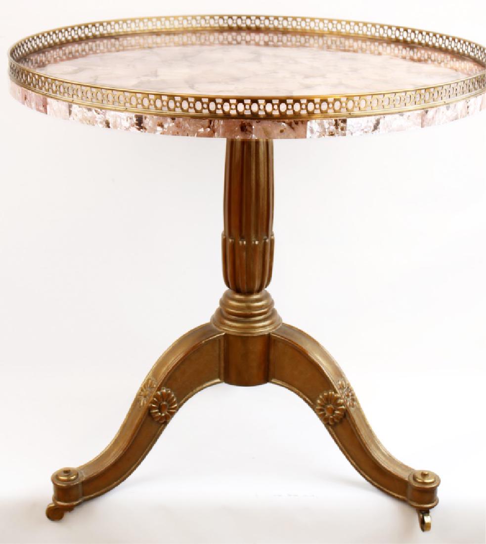 MAITLAND SMITH PINK MOTHER OF PEARL CIRCULAR TABLE: MAITLAND SMITH PINK MOTHER OF PEARL CIRCULAR TABLE Pink mother of pearl accent table. Wooden base with brass finishing and accents. Brass wheels for easy movement. 30" H x 30" diameter Size: 30"