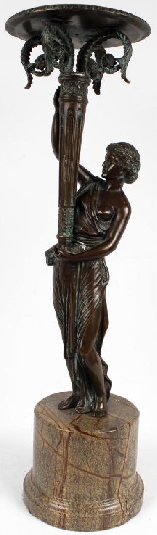 BRONZE LADY LIBERTY STYLE STATUE MARBLE BASE: BRONZE LADY LIBERTY STYLE STATUE MARBLE BASE Bronze statue of Lady Liberty style Grecian woman, holding a torch that is a candle holder. 5" marble circular base. 23.5" total height. Size: 23.5" total