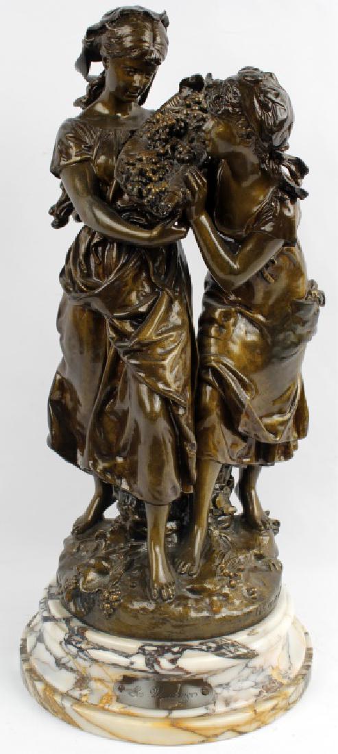 BRONZE STATUE AFTER MOREAU; LES VENDENGES: BRONZE STATUE AFTER MOREAU; LES VENDENGES Bronze statue after Auguste Moreau titled "Les Vendenges." Marble base with a title plate. Two women carrying a basket of grapes over shoulder. Signed lower b