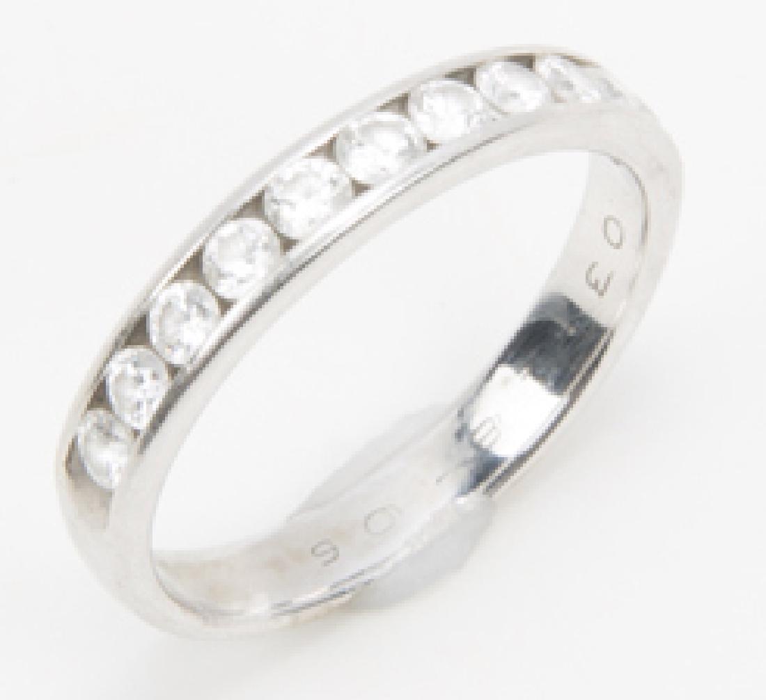 LADIES 14K WHITE GOLD DIAMOND WEDDING BAND: LADIES 14K WHITE GOLD DIAMOND WEDDING BAND Ladies 14K white gold ring featuring eleven .03ct brilliant round white diamonds, inscription inside band. Weight: 2.4 grams Size: 6
