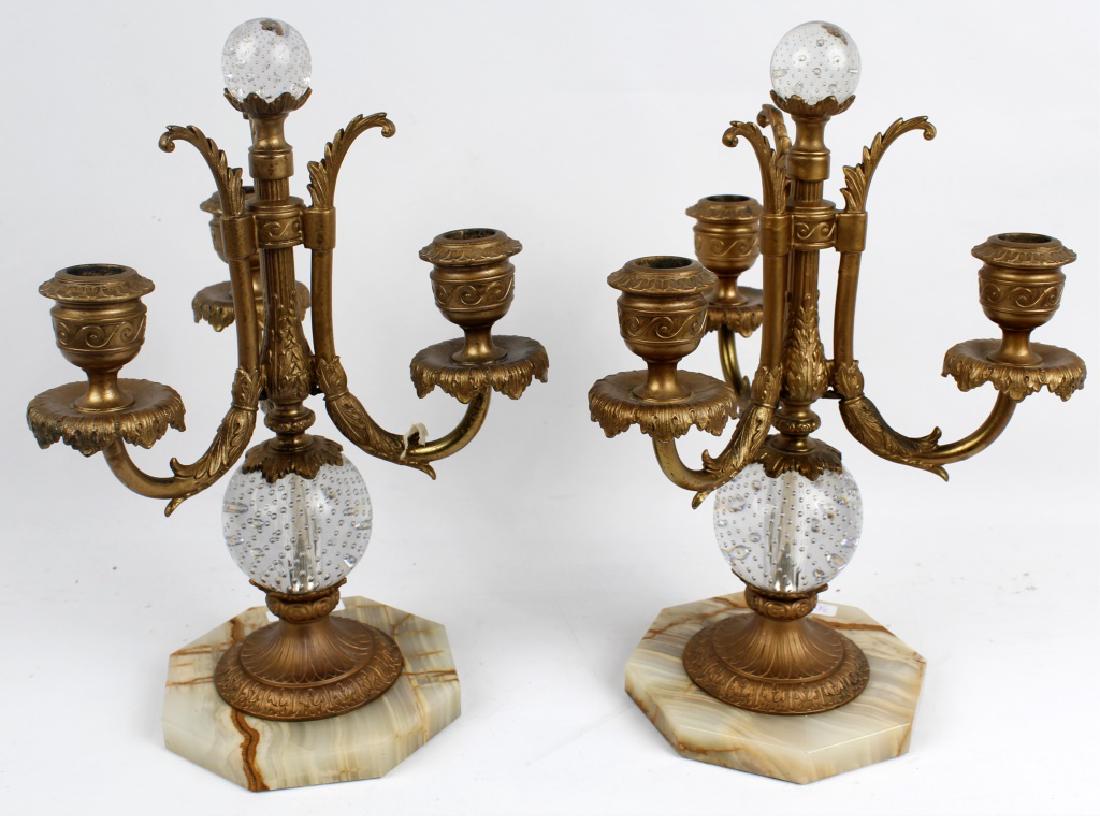 PAIRPOINT GILT CANDELABRAS LOT OF TWO: PAIRPOINT GILT CANDELABRAS LOT OF TWO Pairpoint gilt metal candelabras with hexagonal marble base. Glass spheres with control bubble on the main stem and top. Size: 14"