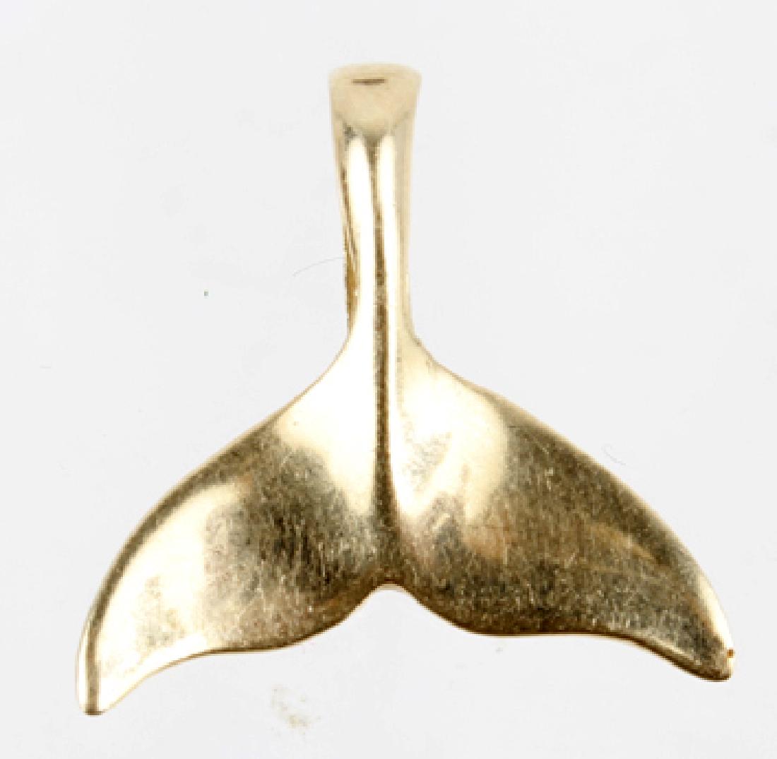 14K YELLOW GOLD DOLPHIN TAIL PENDANT: 14K YELLOW GOLD DOLPHIN TAIL PENDANT 14k yellow gold dolphin tail pendant. Measures 16mm x 17mm , signed MLJ. Weight: 1.1 g
