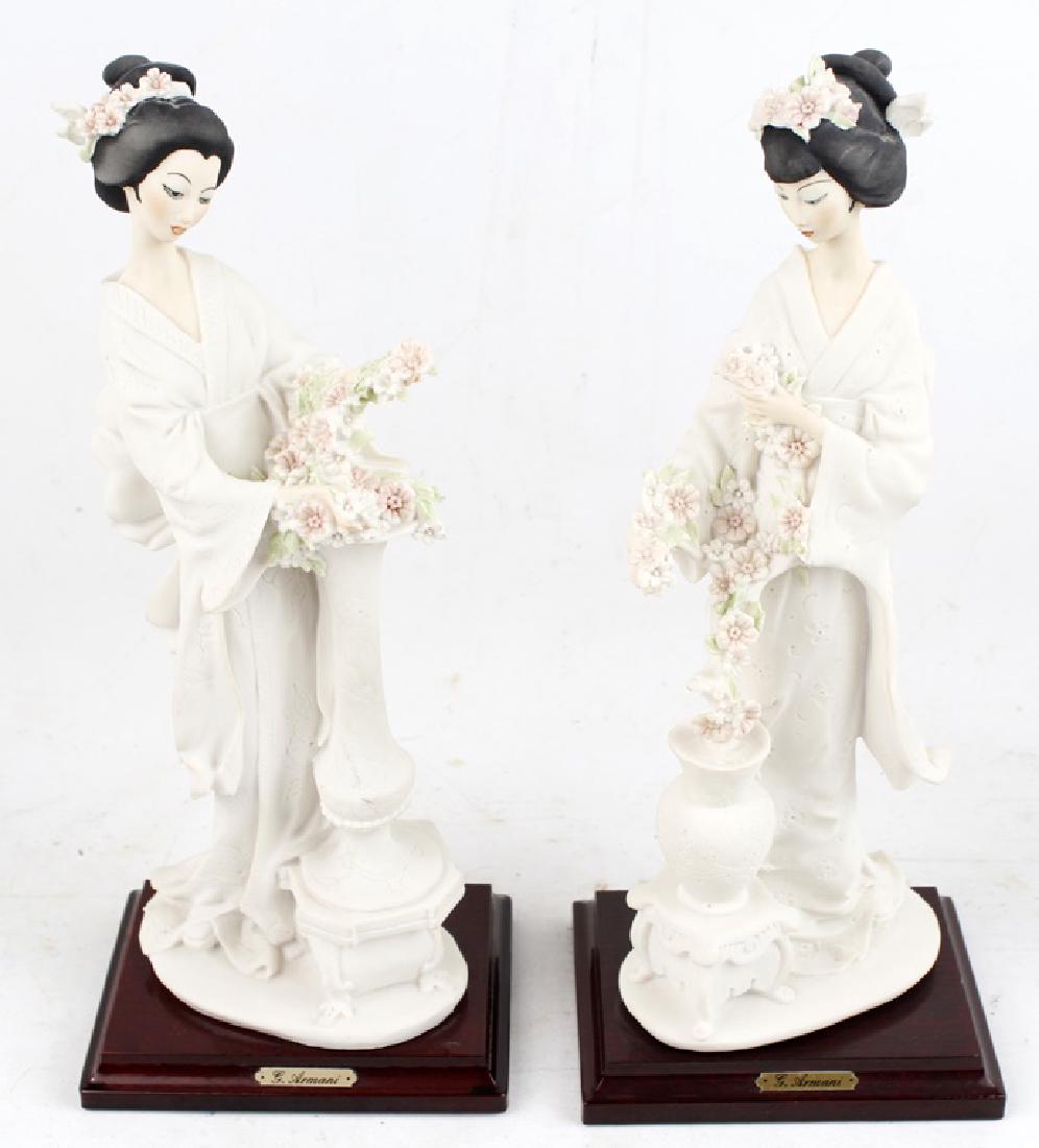 GIUSEPPE ARMANI PORCELAIN FIGURINE JAPANESE WOMEN: GIUSEPPE ARMANI PORCELAIN FIGURINE JAPANESE WOMEN Giuseppe Armani porcelain figurines- lot of two. Japanese geisha girls with vases of pink flowers. Size: 13.5"