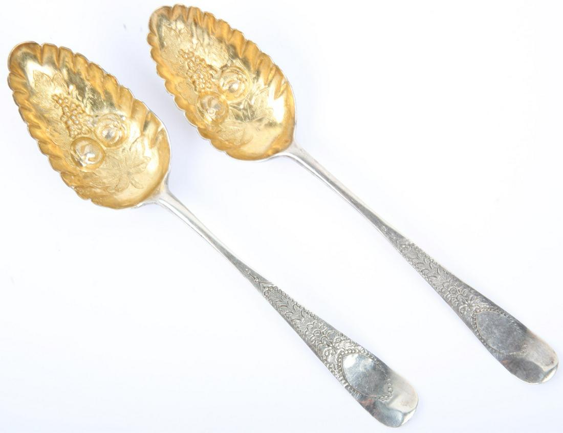 18TH C HESTER BATEMAN STERLING SILVER BERRY SPOONS: 18TH C HESTER BATEMAN STERLING SILVER BERRY SPOONS Sterling silver hallmarked English berry serving spoons, gold wash bowls with ornate high relief accenting. Hester Bateman of London c. 1778. Weight: