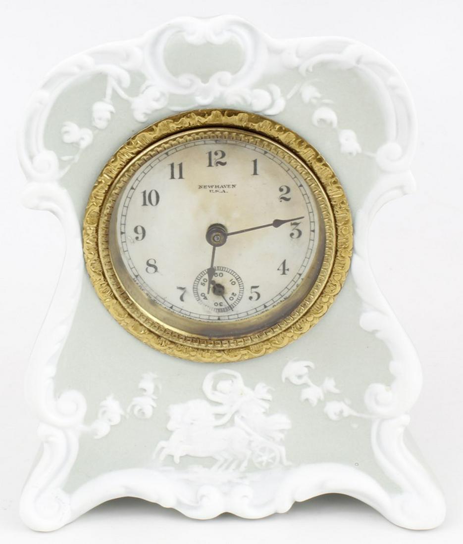 WEDGWOOD JASPERWARE MANTLE CLOCK: WEDGWOOD JASPERWARE MANTLE CLOCK Wedgwood jasperware chime clock. New Haven USA. Clock winds but does not function. Needs servicing. Size: 5" H