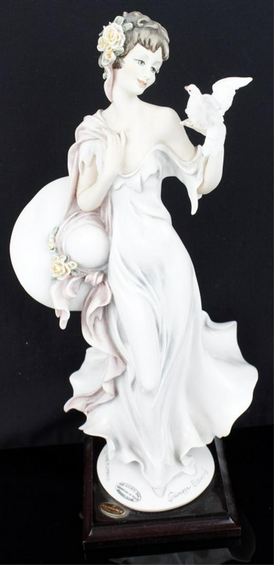 GIUSEPPE ARMANI MESSENGER OF PEACE FIGURINE: GIUSEPPE ARMANI MESSENGER OF PEACE FIGURINE Giuseppe Armani Figurine titled " Messenger of Peace" depicting a women in a white gown holding her sun hat and a dove Size: 13"