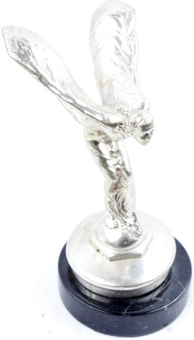 AFTER SYKES SPIRIT OF ECSTASY ROLLS ROYCE STATUE: AFTER SYKES SPIRIT OF ECSTASY ROLLS ROYCE STATUE A good quality heavy silver plated “Spirit of Ecstasy” statuette, after Charles Sykes, mounted on a faux radiator cap and marble base. The Spirit o