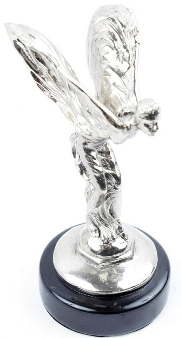 AFTER SYKES SPIRIT OF ECSTASY ROLLS ROYCE STATUE: AFTER SYKES SPIRIT OF ECSTASY ROLLS ROYCE STATUE A silver plated “Spirit of Ecstasy” statuette, after Charles Sykes, mounted on a faux radiator cap and metal base. Size: 6.75"