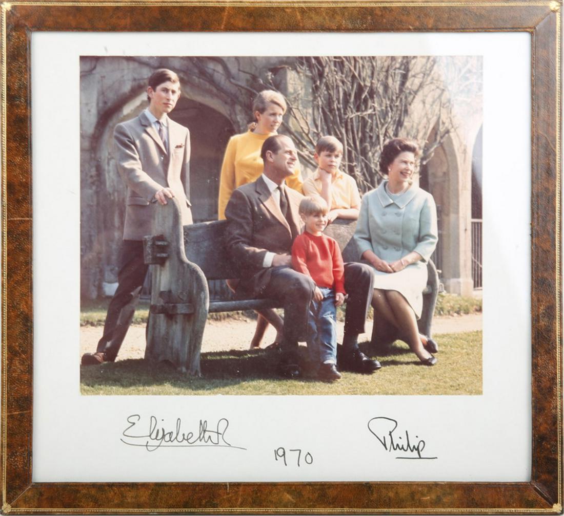 PRINCE PHILIP & ELIZABETH SIGNED FAMILY PHOTOGRAPH: PRINCE PHILIP & ELIZABETH SIGNED FAMILY PHOTOGRAPH British Royalty. A casual color photograph of the British Royal family including H.M. The Queen, Prince Philip, Prince Charles, Princess Anne, Prince