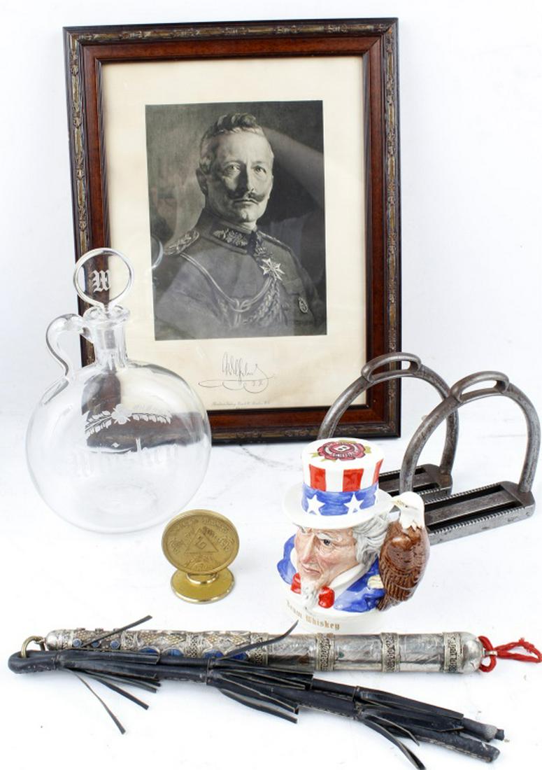 20TH C. COLLECTIBLES - DECANTER, STIRRUPS, ETC.: 20TH C. COLLECTIBLES - DECANTER, STIRRUPS, ETC. To include: A Royal Doulton Beam Whiskey Patriotic flask/decanter, sealed with liquid inside, depicting Uncle Sam with an eagle handle. Inscribed on bac