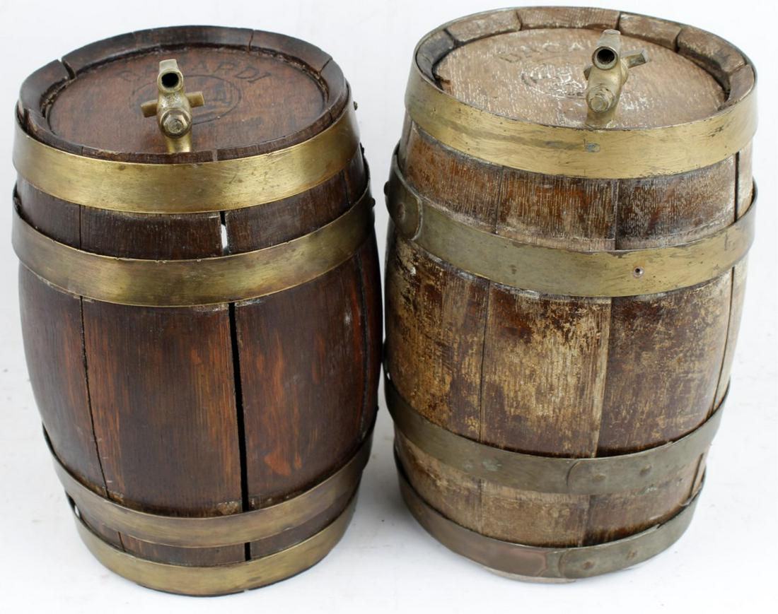 BACARDI OAK STAVE BRASS BOUND BARRELS - LOT OF 2: BACARDI OAK STAVE BRASS BOUND BARRELS - LOT OF 2 Two 20th Century marked Bacardi Rum oak stave and brass band barrels, complete with brass taps bearing the Bacardi name. Each has the Bacardi logo (a f