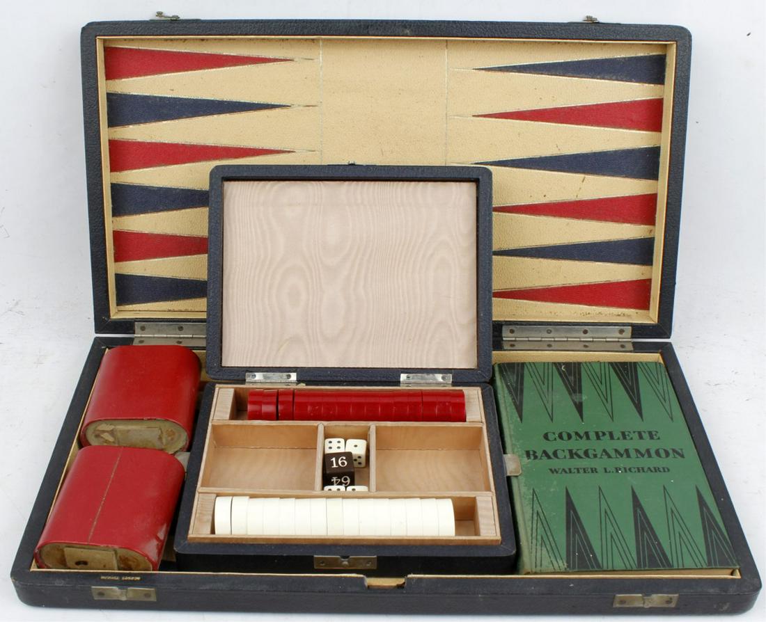 1930`S DUNHILL LONDON BACKGAMMON GAME SET: 1930`S DUNHILL LONDON BACKGAMMON GAME SET A 1 930’s leather backgammon set by Alfred Dunhill of London. 17 ½ x 9 ½ x 2 inches. Board opens to full board size with red blue and yellow leather inter