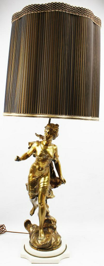 AFTER MOREAU CAST "DIANE CHASSERESSE" LAMP: AFTER MOREAU CAST "DIANE CHASSERESSE" LAMP Cast gold tone sculpture "Diane Chasseresse" after Hippolyte Moreau as table Lamp. Tag with named label affixed to sculpture on white marble base with sheer
