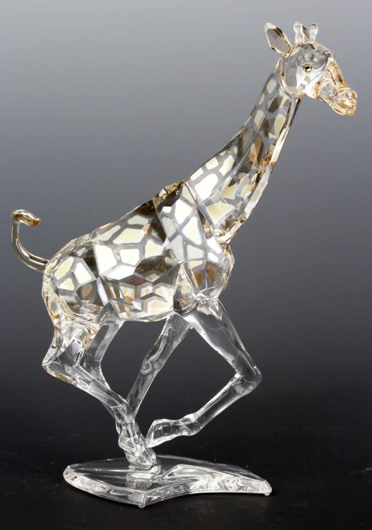 SWAROVSKI CRYSTAL COLLECTION LARGE GIRAFFE: SWAROVSKI CRYSTAL COLLECTION LARGE GIRAFFE Swarovski crystal collection "Giraffe" with metallic gold detailing. Number 9100 NR 000 103. In original Box. Size: 6.5"