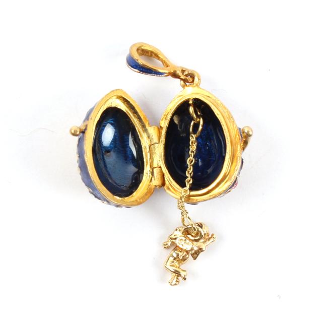 STERLING SILVER GOLD GILT SWAROVSKI RUSSIAN EGG: STERLING SILVER GOLD GILT SWAROVSKI RUSSIAN EGG Sterling silver colorfully enameled Russian miniature egg necklace pendant / locket, accompanied by paperwork. Weight: 6.6 grams Size: .75"