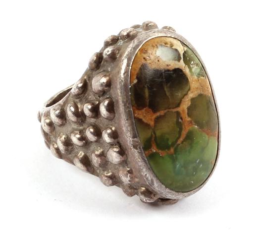 STERLING SILVER TURQUOISE RING PHIL ROWE: STERLING SILVER TURQUOISE RING PHIL ROWE Sterling silver green turquoise beaded pattern large fashion ring by Phil Rowe. Weight: 24.0 grams Size: 8.5