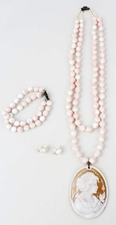 LADIES STERLING SILVER AGATE CAMEO JEWELRY: LADIES STERLING SILVER AGATE CAMEO JEWELRY Ladies pink and white stone beaded necklace, earring, and bracelet set, necklace with carved and signed cameo pendant. Weight: 155.9 grams