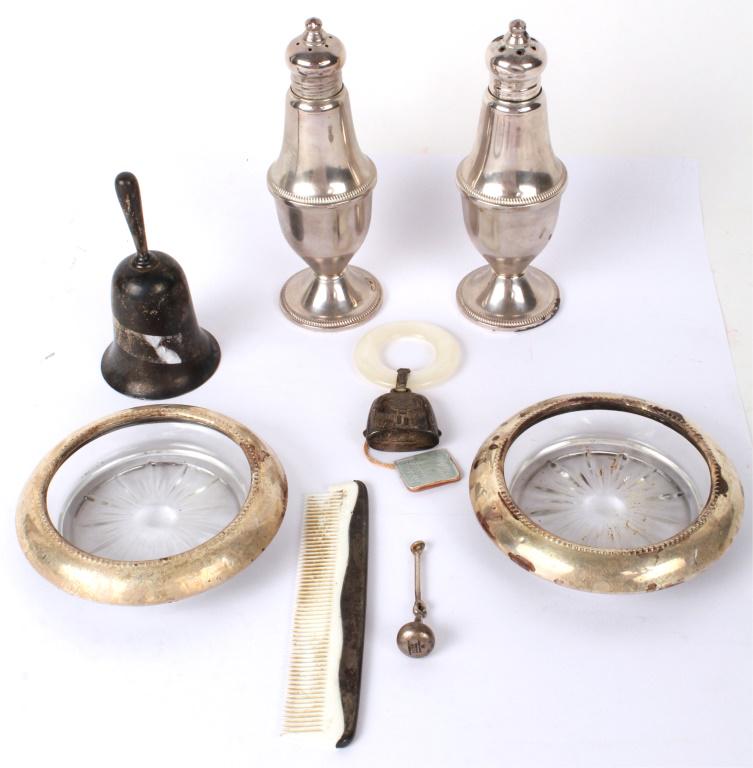 STERLING SILVER ITEMS - SHAKERS BELL COASTERS ETC.: STERLING SILVER ITEMS - SHAKERS BELL COASTERS ETC. Lot of sterling silver weighted and solid items, to include: Duchin shakers, Whiting coasters, Webster teething ring, and a bell with Tiffany sterlin