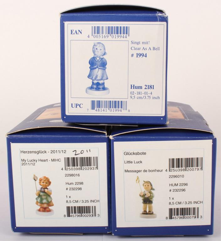 M.J.HUMMEL LOT OF 3 - HUM 2298, HUM2181, & HUM2296: M.J.HUMMEL LOT OF 3 - HUM 2298, HUM2181, & HUM2296 Hummel figurines by Goebel lot of 3. Includes Little Luck, My Lucky Heart, and Clear as a Bell. All In original boxes. Size: Largest 3.75"
