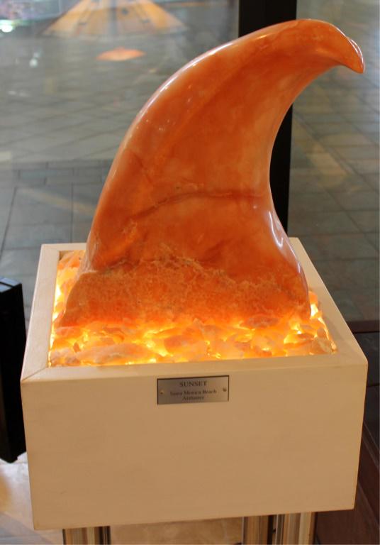 CARLENE DANART CARVED ALABASTER STATUE: CARLENE DANART CARVED ALABASTER STATUE Carlene Danart (American), carved alabaster sculpture titled "Sunset". Graduate of FSU School of Fine Arts, Signed and dated. Sits atop a custom bottom lit stand