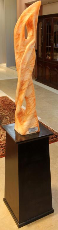 CARLENE DANART CARVED ORANGE ALABASTER STATUE: CARLENE DANART CARVED ORANGE ALABASTER STATUE Carlene Danart (American), carved orange alabaster sculpture titled "Cobras". Graduate of FSU School of Fine Arts, Signed and dated. Sits atop a custom st