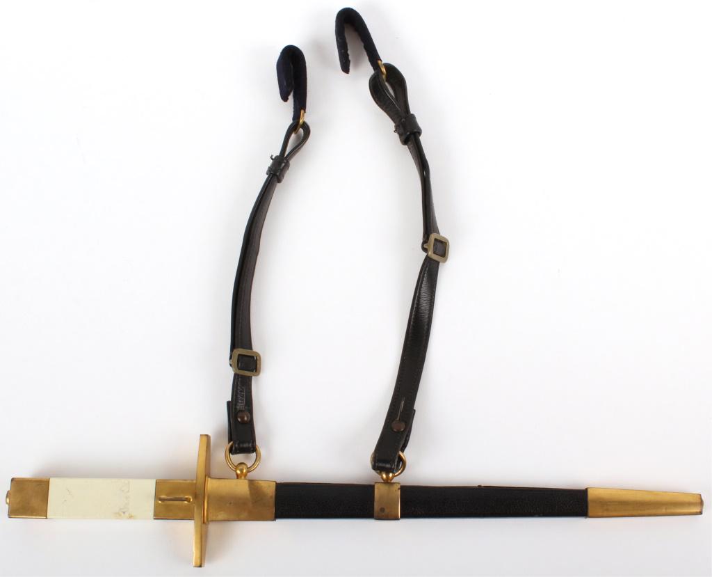 VINTAGE BRASS HANDLE DAGGER WITH LEATHER SHEATH: VINTAGE BRASS HANDLE DAGGER WITH LEATHER SHEATH Brass handle stainless steel dagger with leather and brass sheath with leather straps and hooks to hang from a belt or saddle. Size: 16" Condition: Very