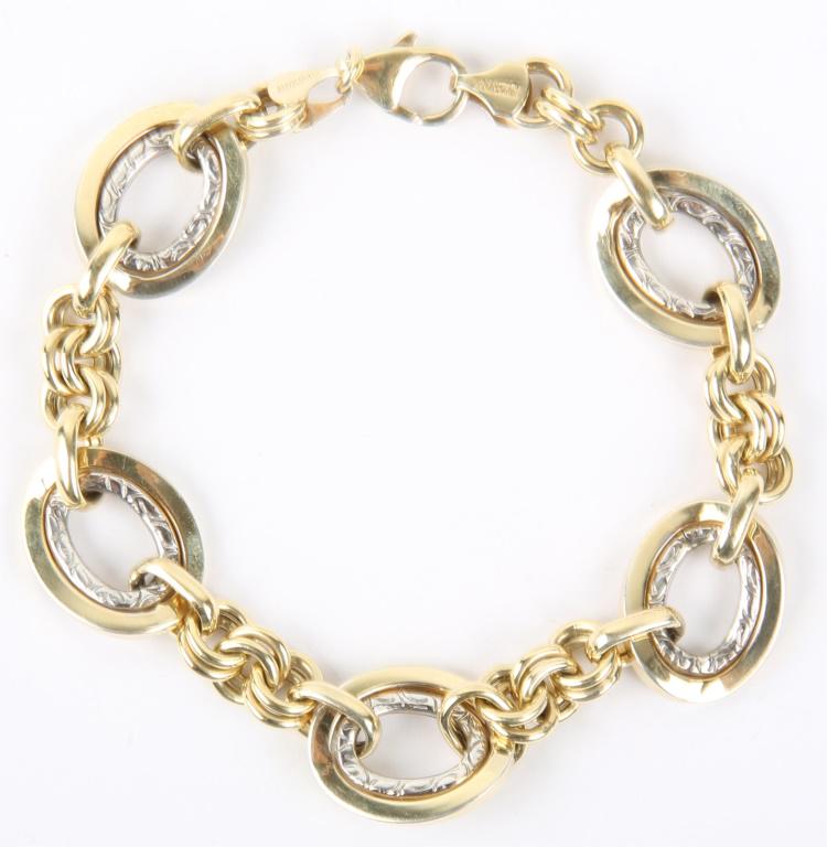LADIES 14K YELLOW GOLD & STERLING SILVER BRACELET: LADIES 14K YELLOW GOLD & STERLING SILVER BRACELET Ladies 14k yellow gold and sterling silver chain link fashion bracelet, signed on clasp. Weight: 10.6 grams Size: 7.5" chain Condition: Fine.