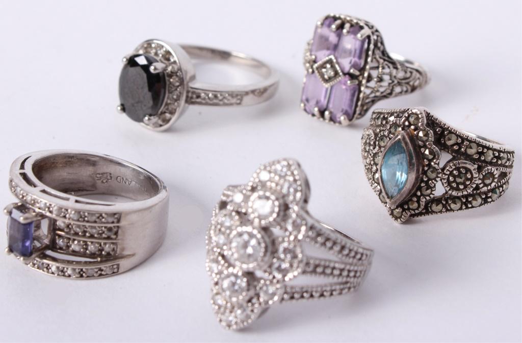STERLING SILVER FILIGREE GEMSTONE RINGS - LOT OF 5: STERLING SILVER FILIGREE GEMSTONE RINGS - LOT OF 5 Sterling silver filigree gemstone rings with one aquamarine and marcasite ring, one amethyst ring, one tanzanite ring, one sterling CZ ring, and one 