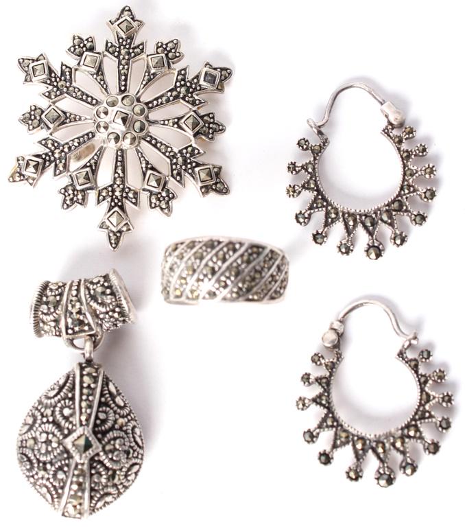 STERLING SILVER & MARCASITE JEWELRY SET - LOT OF 4: STERLING SILVER & MARCASITE JEWELRY SET - LOT OF 4 Sterling silver .925 and Marcasite jewelry set with 2 pendants, 1 pair of snowflake design earrings, and one ladies ring. Weight: 27.7 Grams Size: Ri