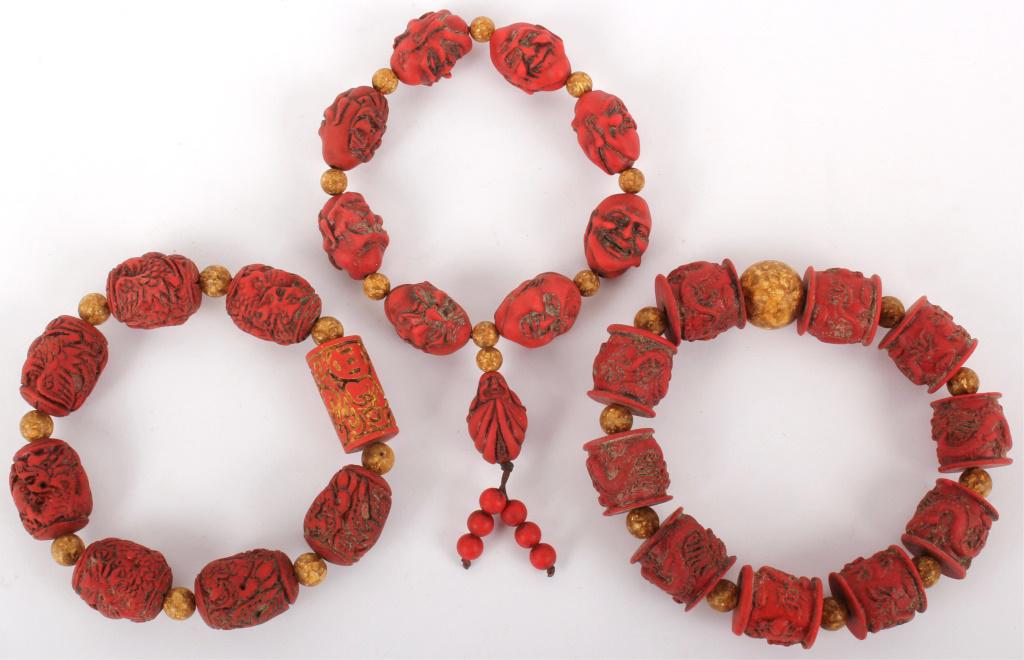 ASIAN WOOD CARVED COSTUME BRACELETS - LOT OF 3: ASIAN WOOD CARVED COSTUME BRACELETS - LOT OF 3 Asian wood carved beaded red costume bracelets - lot of 3. Condition: Very fine
