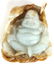 CARVED GREEN & RUSSET JADE BUDDHA PENDANT