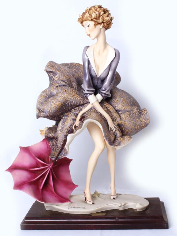 GIUSEPPE ARMANI SCULPTURE "THE UMBRELLA - AUTUMN": GIUSEPPE ARMANI SCULPTURE "THE UMBRELLA - AUTUMN" Giuseppe Armani hand-signed porcelain Capodimonte sculpture "The Umbrella - Autumn". 1979-1980 hand signed by the artist in pen next to date stamp. Si