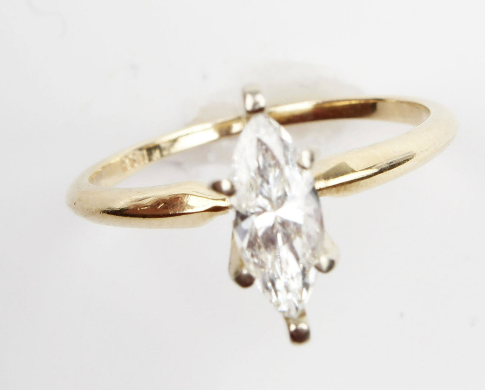 14K YELLOW GOLD MARQUISE CUT DIAMOND RING: 14k yellow gold .60ct solitaire marquise cut ring. H color VS clarity. Weight: 1.8 grams Size: 5.25 Condition: Very Fine.