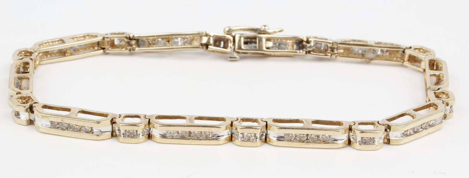 14K YELLOW GOLD CHAMPAGNE DIAMOND TENNIS BRACELET: 14k yellow gold champagne diamond tennis bracelet. 3.6mm wide 8" long. Fifty .02 ct natural Champagne colored diamonds Vs2 clarity channel set in yellow gold links. Weight: 12.7 grams Condition:
