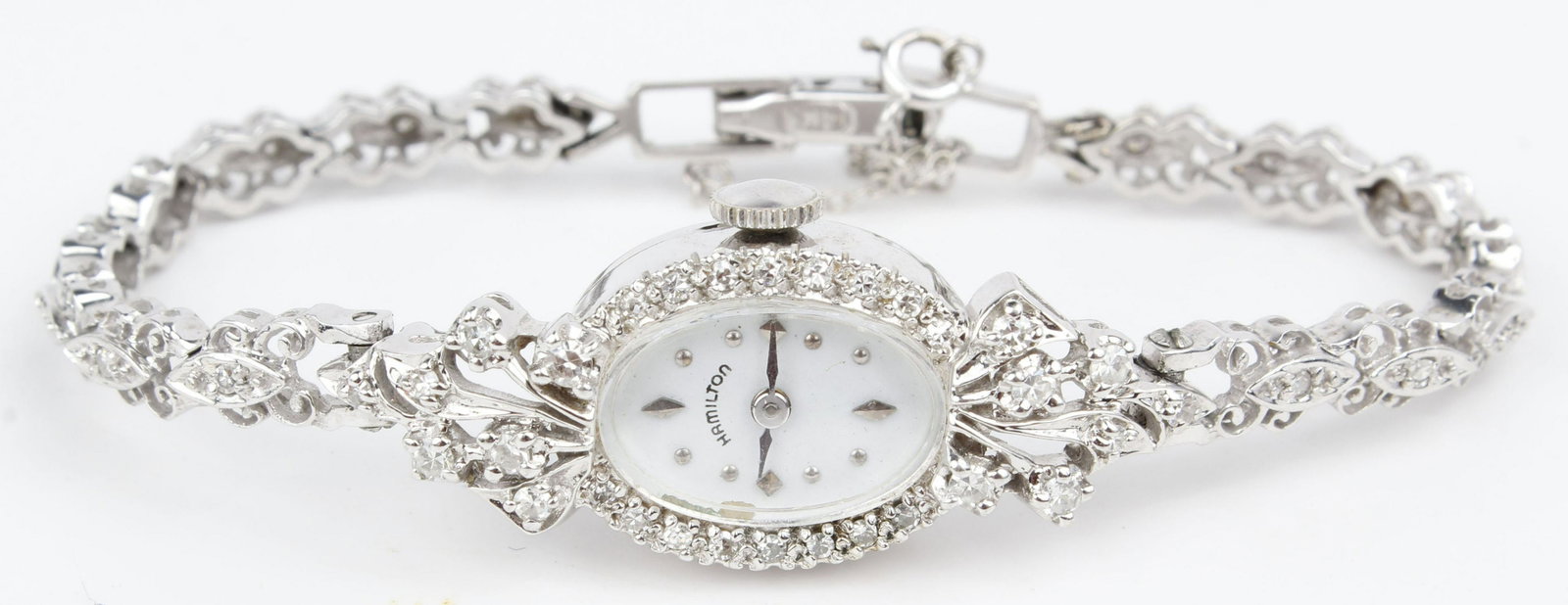 14K WHITE GOLD LADIES HAMILTON DIAMOND WATCH: 14k white gold and diamond ladies Hamilton wristwatch. Bracelet and case in pristine unworn condition with minor blemish to acrylic crystal which can be buffed out. Weight: 16.6 grams Condition: Very