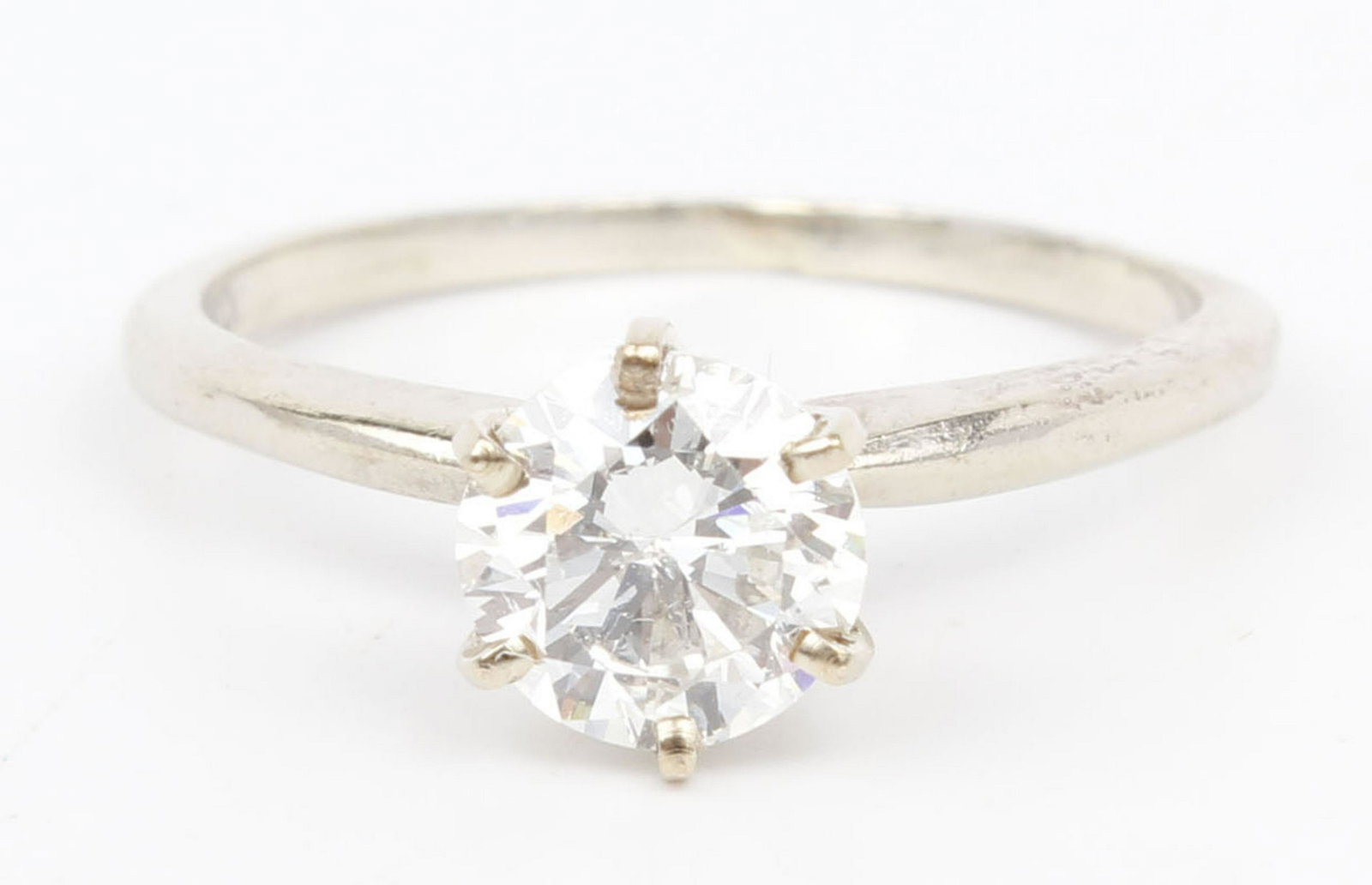 14K WHITE GOLD ROUND DIAMOND SOLITAIRE .82CT: Ladies 14k white gold diamond solitaire engagement ring. A .82ct round diamond solitaire, six prong setting with a 2mm band. Weight: 2.0 grams Size: 6 Condition: Very Fine.